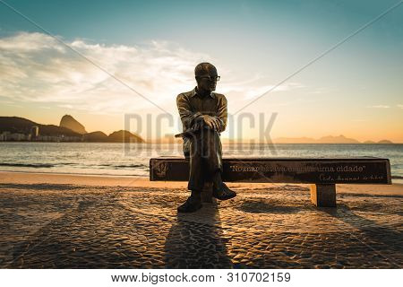 Rio De Janeiro, Brazil - July 1, 2019: Statue Of Brazilian Poet Carlos Drummond De Andrade Sitting O