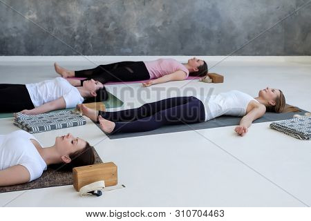 Women Practicing Yoga Lesson, Doing Dead Body, Savasana, Exercise Corpse Pose