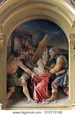 ZAGREB, CROATIA - MARCH 11: 5th Stations of the Cross, Simon of Cyrene carries the cross, Saint John the Baptist church in Zagreb, Croatia, on March 11, 2017.