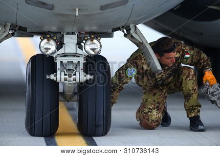 Otopeni, Romania - May 22, 2019: A Mechanic Is Inspecting Parts Of An Alenia C-27j Spartan Military 