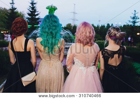 High Fashion Model Woman With Multi-colored Hair Posing In The Studio, Portrait Of A Beautiful Sexy 