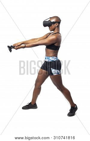 Athletic Woman Exercising While Playing Video Game By Practicing Vr Sword Fighting Or Swordplay With