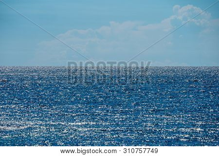 Holizontal Glitter - Glossy Sunlight Reflexion In The Sea Line And Open Sky.