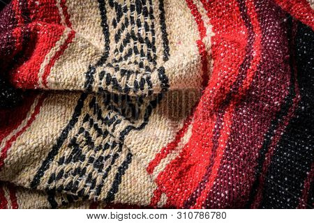 Mexican Serape blanket on wood Background