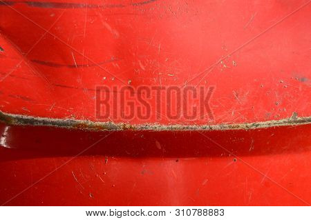 Red Painted Metal Background With Rust. Close-up