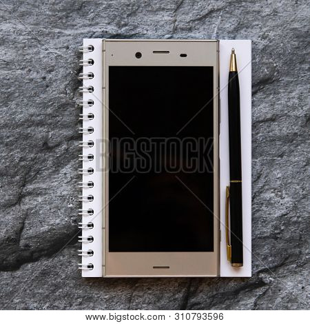 Still Life: Smartphone, Notebbook And Pen. Flat Lay