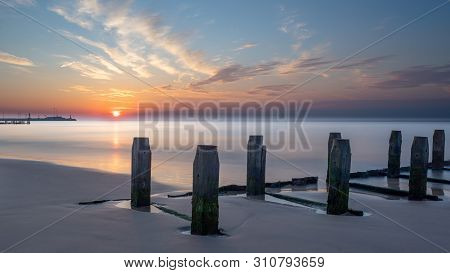 Lowestoft, Suffolk, England, Uk - May 24, 2019: Pastel Colours Of Early Morning Sunrise From The Bea