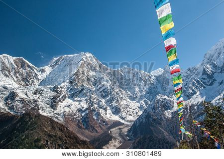 View Of Snow Covered Range Of Mount Manaslu And Prayer Flags 8 156 Meters With Clouds In Himalayas, 
