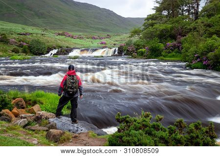Man Looking At Aasleagh Falls County Mayo Ireland