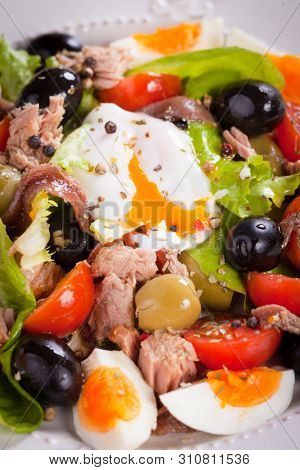 French Nicoise salad with eggs, tuna, olives  and vegetables