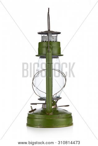 Vintage kerosene lamp isolated on white background. Glass oil lamp. Storm lantern/ Side view.