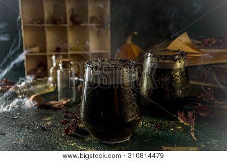 Halloween Party Drink Idea, Witches Brew Black Sangria On Halloween Styled Table