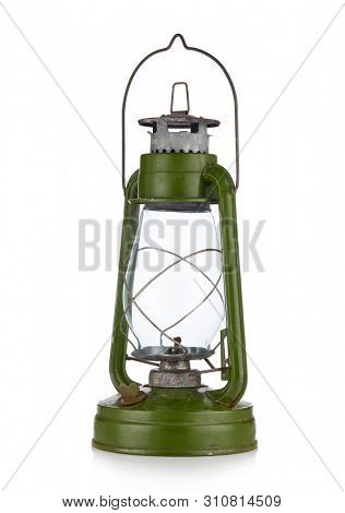 Vintage kerosene lamp isolated on white background. Glass oil lamp. Storm lantern. Diagonal view
