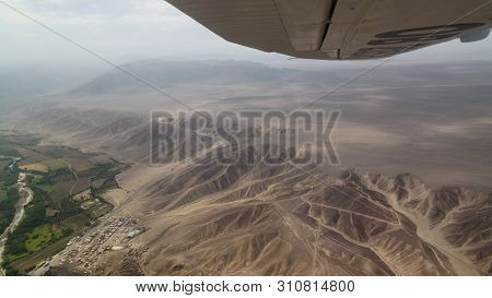 Aerial Airplane Panoramic View To Nazca Plateau With Geoglyph Lines , Ica Region, Peru