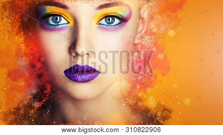 Winter Beauty Woman. Christmas Girl Makeup. Creative Color Make-up. Beautiful Young Woman Face Close