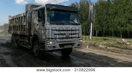 Kazakhstan, Ust-kamenogorsk, June 17, 2019: White Cnhtc Howo Sinotruk Dump Truck On The Road. Constr