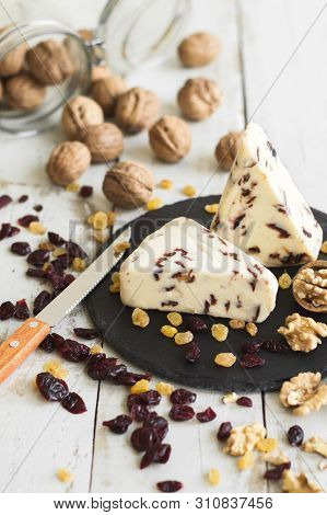 Cranberry Cheese Served With Walnut, Raisin And Dried Cranberry. Sweet Cheese With Fruity Flavour