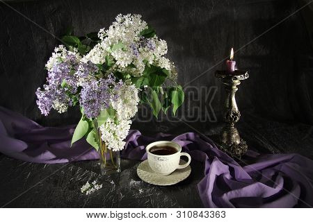 Сup Of Tea And A Bouquet Of Lilac