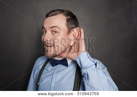 Funny Man With Big Ear Overhear On Blackboard