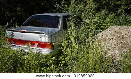 Kazakhstan, Ust-kamenogorsk, June 17, 2019: Lada Samara (vaz 2115). Derelict Old Car Is Overgrown Wi