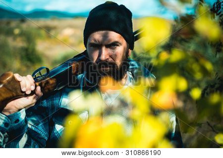 Hunter In The Fall Hunting Season. Calibers Of Hunting Rifles. Man Holding Shotgun. Hunting In Sprin