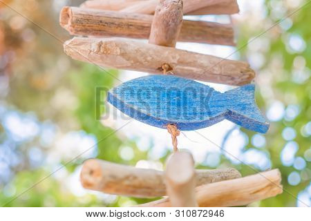 Wooden Fish Simbol. Wooden Fish Hanging On The Rope. Fish Symbolizing Fish Food. Fish Sign Of Faith.