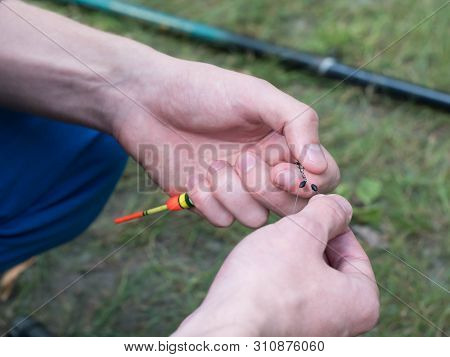 Man Clings To Fishing Line Close Up