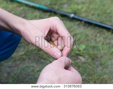 Man Clings To Fishing Line Close Up