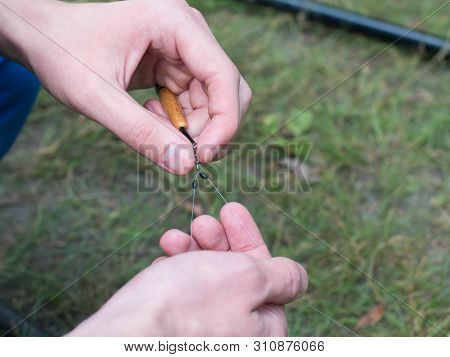 Man Clings To Fishing Line Close Up