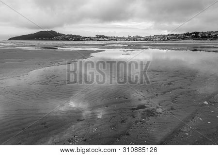 Reflections In Low Tide In Black And White
