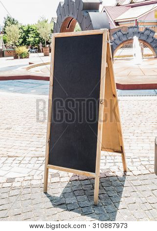 Black Chalk Board On Street In Sochi Park