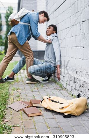 Aggressive Boy In Shirt Bulling Frightened African American Boy In Hoodie