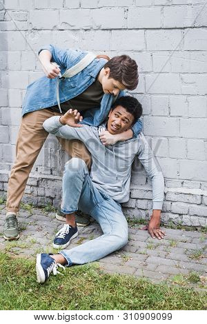 Angry Boy In Shirt Bulling, Going To Punch Frightened African American Boy In Hoodie
