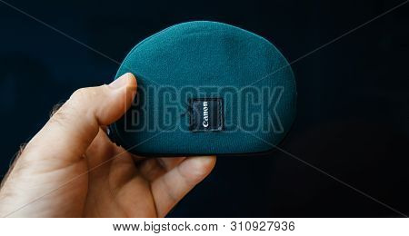 Paris, France - June 7, 2019: Man Hand Holding Protection Case Of Vintage Canon Ixus X-1 Elph Sport 