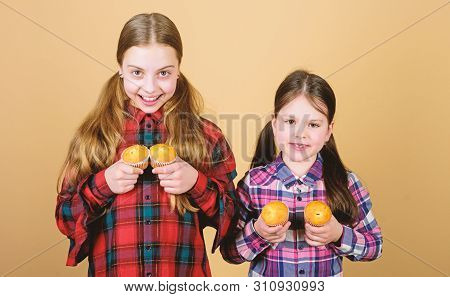 Muffin Fight. Small Children Happy Smiling With Quickbread Muffins. Happy Little Girls Baking Breakf