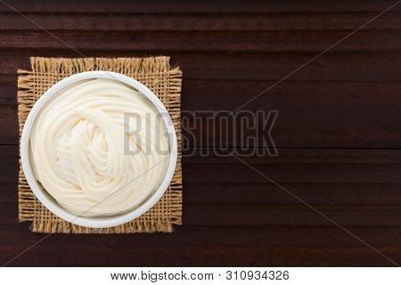 Mayonnaise Sauce In White Bowl, Photographed Overhead With Copy Space On The Side (selective Focus, 