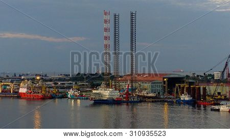 Labuan,malaysia-july 6,2019:offshore Supply Vessels & Jackup Oil Rig Platform Under Repair And Maint