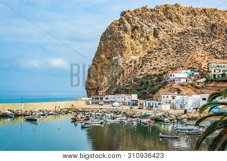 El Jebha, Morocco - October 19, 2013. Marina With Colored Boats By Mediterranean Sea