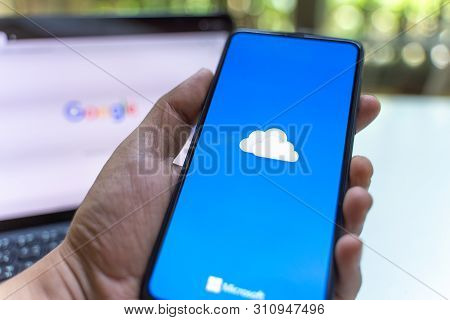 Chiang Mai, Thailand - May.26,2019: Man Holding Xiaomi Mi Mix 3 With Onedrive On Screen. Microsoft O