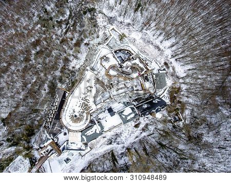 Aerial View Rock With Medieval Castle On It Near Moselle River In Brodenbach Winter With Forest Snow