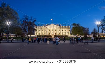 Washington, Dc, Usa -april, 4, 2017: Night Time Long Exposure Shot Of Tourists At The White House In
