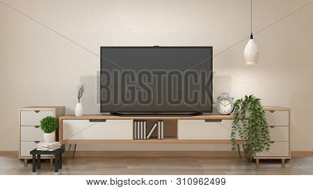 Tv On Cabinet In Zen Living Room With Lamp,table,cabinet And Plant .3D Rendering