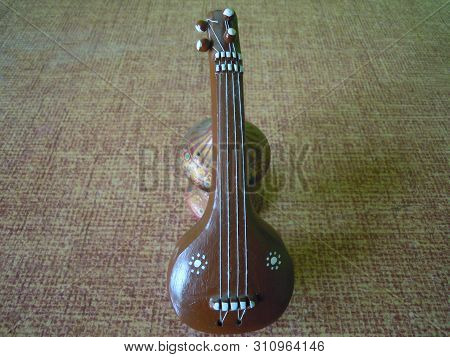 A Clay Model Of Musical Instrument Which Is Called Setar.