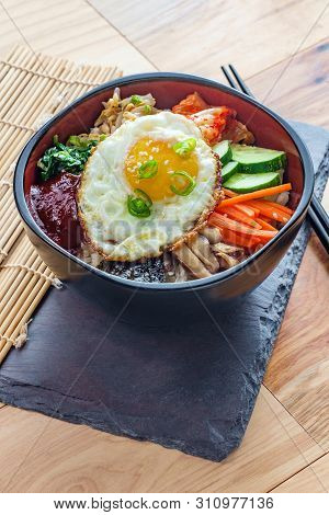 Authentic Korean Cuisine Vegetarian Cold Bibimbap On Wooden Table