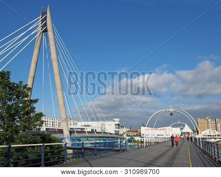 Southport, Merseyside, United Kingdom - 28 June 2019: People Walking Along Along The Pier In Southpo