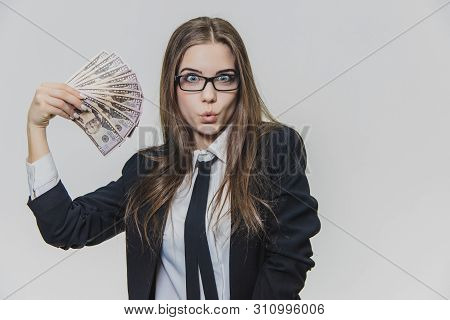 Satisfied, Excited Young Business Woman Is Showing A Pile Of Money, Isolated On White Background. Gi