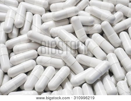 Pills medicine, vitamin or dietary supplements close-up as background