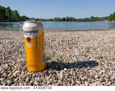 Bosnia And Herzegovina - June 27, 2020: Banjalucko Beer On The Beach Next To The Artificial Lake Man