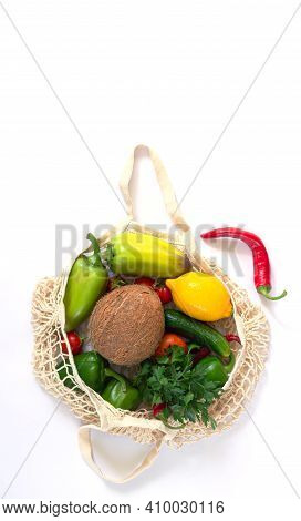 Reusable Mesh Bag For Grocery With Fruits And Vegetables. Zero Waste And No Plastic Shopping Concept