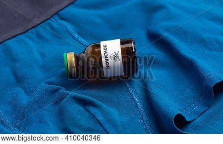 Poison Bottle Newbie On The Background Of Underwear. Chemical Weapons Concept New To Navalny